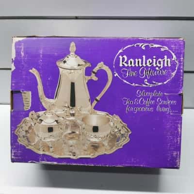 Vintage 4-piece silver-plated service set (Teapot/Coffee Pot, Sugar Bowl, Creamer, and Serving Tray).