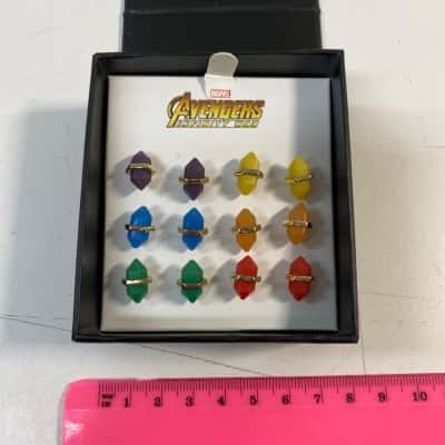 Marvel Avengers Infinity War crystal point stud earrings featuring a vibrant blue double-terminated stone design secured with a gold-tone metal bar.