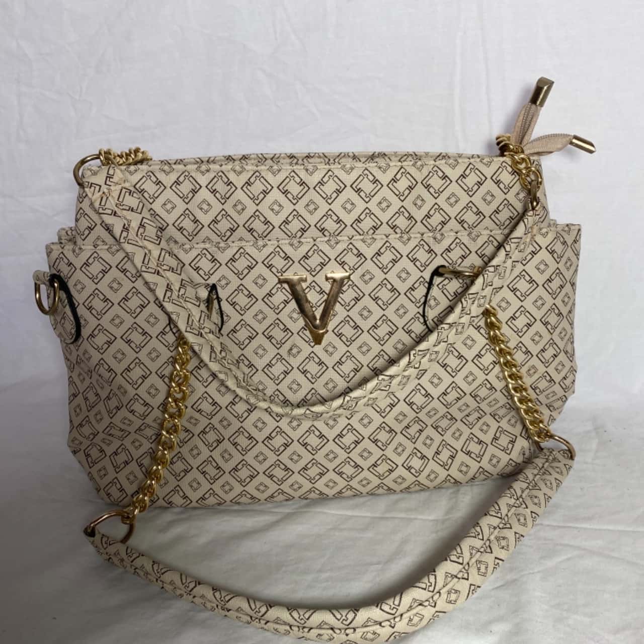Beige leather handbag with golden latch