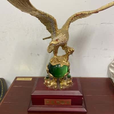 Feng Shei flying eagle statue gilded in metal with rhinestone detailing, mahogany base 