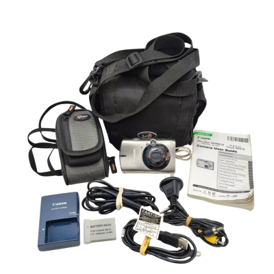 In Excellent Working Condition Canon IXUS 960 IS 12.1MP Digital Compact Camera With Titanium Body - Includes 2 Batteries & Charger, 4gb Memory Card, USB & AV Leads & Instruction Book, Lowepro Pouch + Small Shoulder Bag. See Description