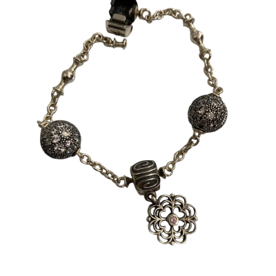 Pandora Womens silver bracelet with 3 charms.