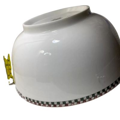 a white ceramic serving bowl featuring a distinctive checkerboard and platinum trim border, closely resembling