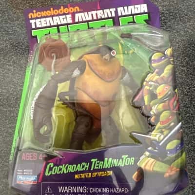 Nickelodeon Teenage Mutant Ninja Turtles (TMNT) Cockroach Terminator action figure. The packaging includes a warning about small parts, making it unsuitable for children under 3 years old.(B8)