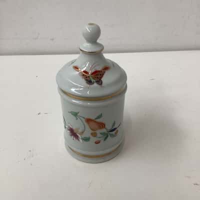 porcelain jar with gold leaf and hand painted  designs 