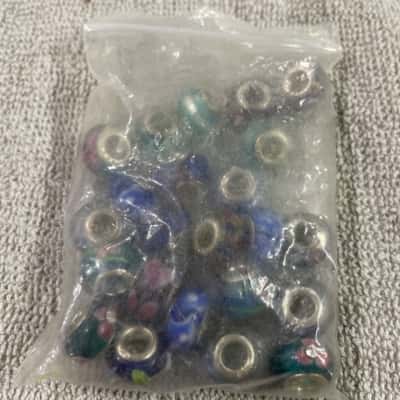  Womens 23 assorted blue and silver beads 