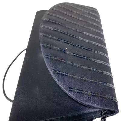 vintage Olga Berg black satin evening clutch featuring a curved front flap, subtle horizontal pleating, and rows of black bugle bead rows