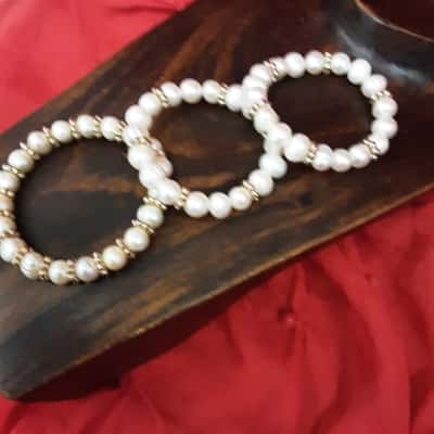 Faux freshwater pearl elasticated bracelets set of three featuring Gold Tone spacer beads
