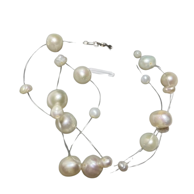  Womens pearl necklace featuring irregular white freshwater baroque pearls strung on a nearly invisible line