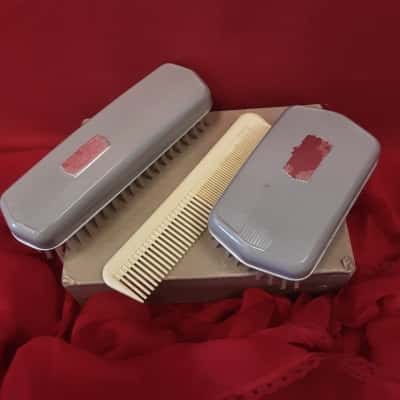 Vintage set featuring bakerlite material  3  brush and  comb original with box
