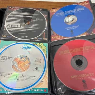 Collection of 55 assorted CDs in carry case