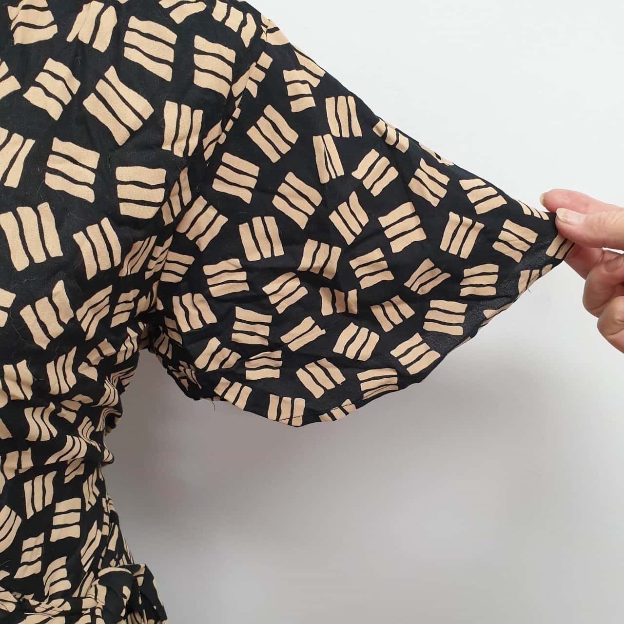 Capture Gorgeous Geo Print Black & Caramel Patterned Wrap Dress 
