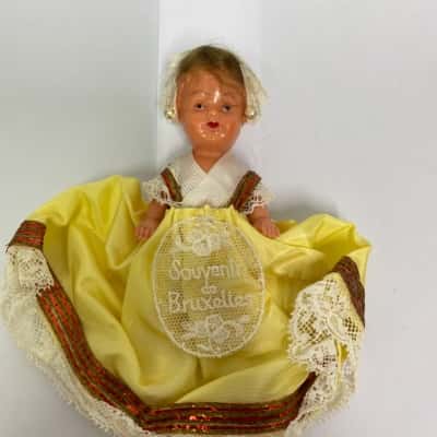 Vintage Hard Plastic Doll Wearing A Traditional Lace Dress and Bonnet (Brussels,Belgium) 