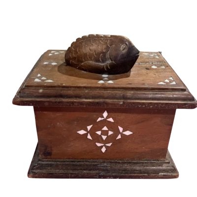 Vintage wooden trinket box featuring a hand - carved fish