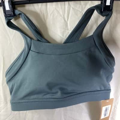  Womens  Size XS grey Elite Eleven sports bra features a prominent "EE" logo on the chest.