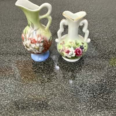 Set of two vintage miniature porcelain bud vases, likely made in Japan,they are hand-painted with floral patterns and feature gold trim,the vases measure approximately 2.25 to 2.5 inches each in height.(B12)