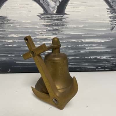 Antique brass bell with anchor 