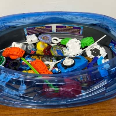Collection of Beyblade Burst spinning tops, launchers, ripcords and spare parts