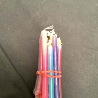 Hand dipped, multicoloured taper candles. 