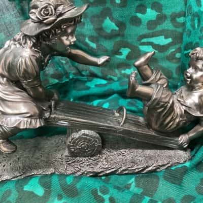 Children on a See-Saw Sculpture 