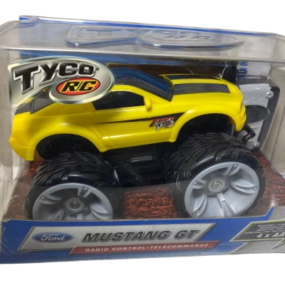 vintage Tyco RC Big Rides Mustang GT remote-controlled toy car in yellow and black, released by Mattel in 2004.