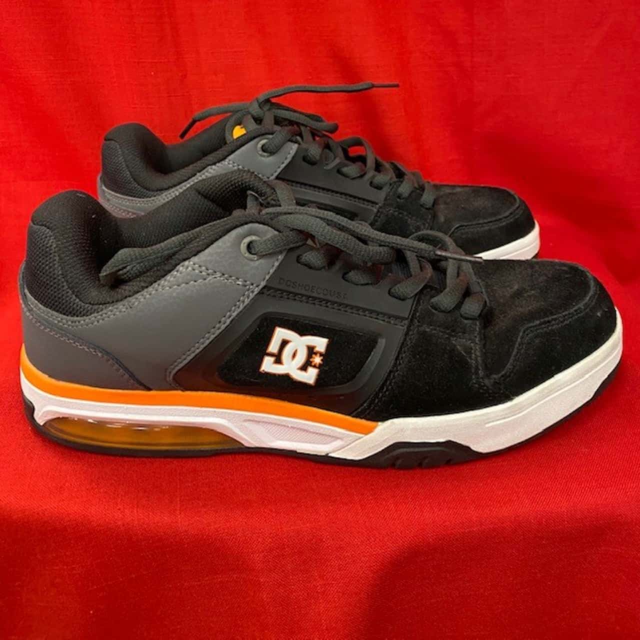 black and orange dc shoes