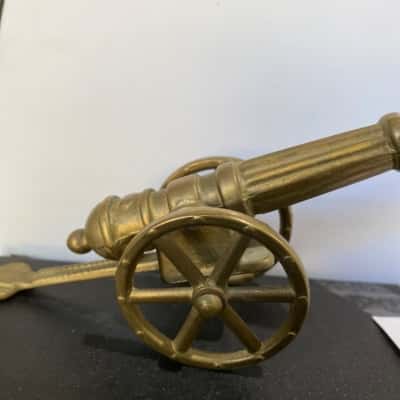 Vintage miniature brass canon ornament with moving wheels