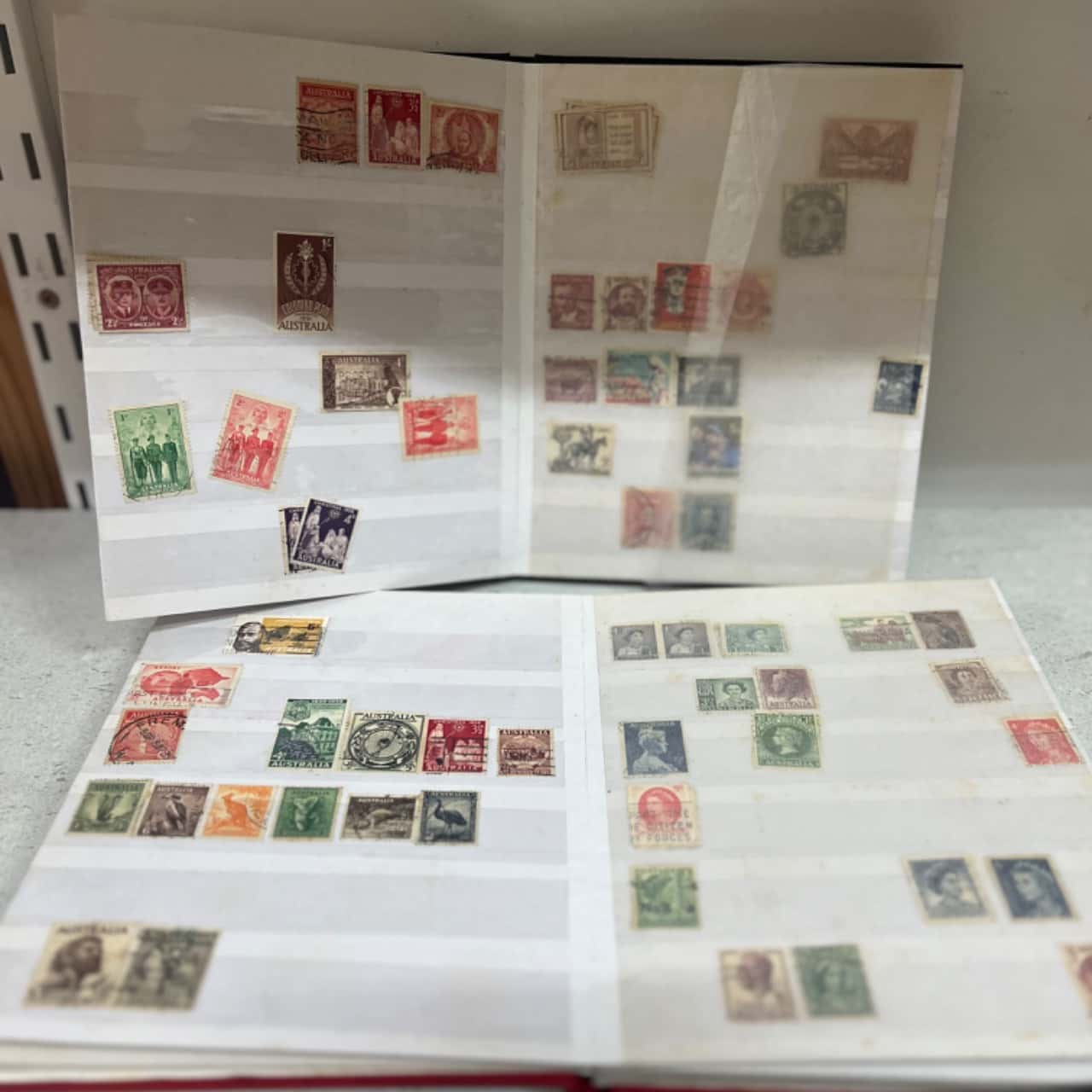 Many Treasures-2x Stamp Albums full of assorted stamps-(s)