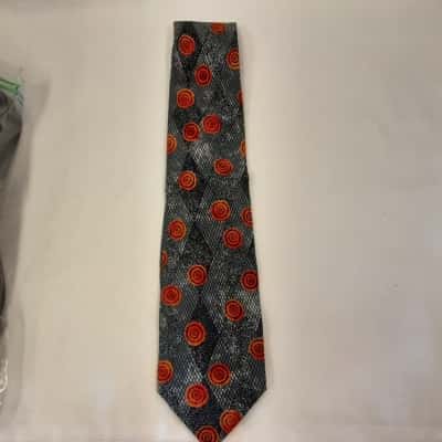 Hom Silk Necktie  Featuring a Structured Grey Black Textured Diamond Grid Pattern With Vibrant Orange 