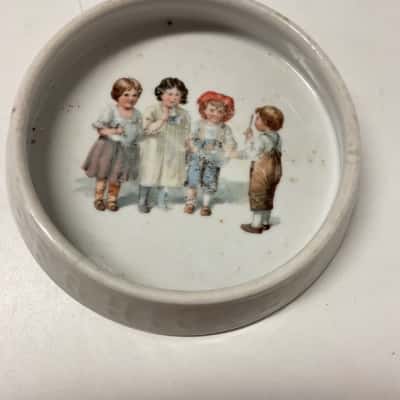 Vintage feeding dish with children with musical instruments