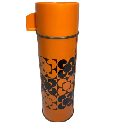 vintage Aladdin thermos vacuum flask. This specific model features a distinctive bright orange exterior decorated with a black geometric "scallop flower" or floral tile pattern, characteristic of 1970s retro design.