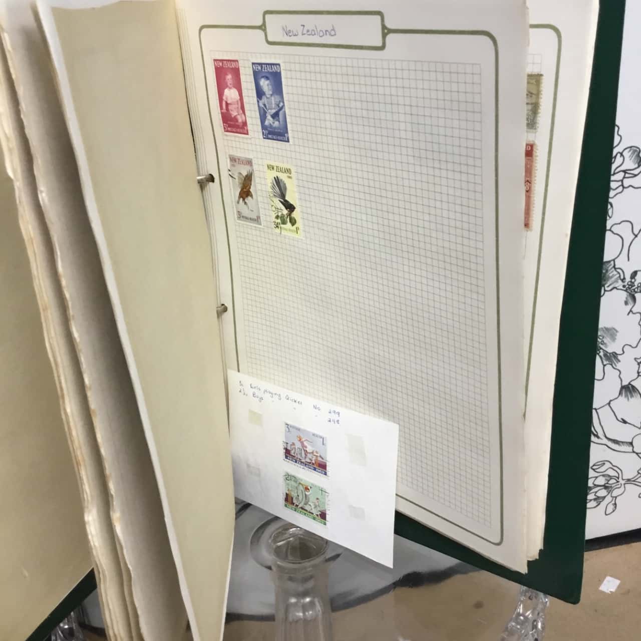 stamp collection in green binder (s)