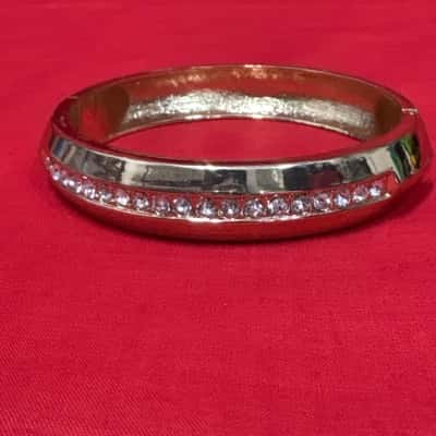  Women's Gold Tone Hinged Bangle featuring a Central Row of Rhinestone Accents