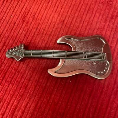 designer belt with guitar buckle