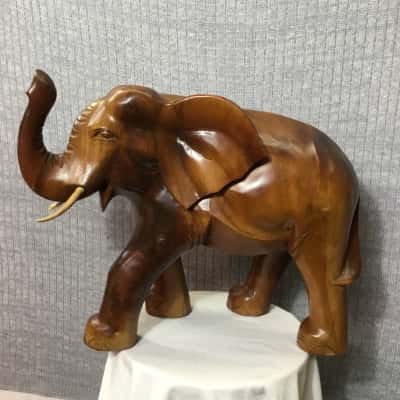 Wooden carved Elephant with task