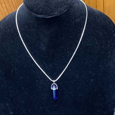 Womens Sterling silver Necklace with Blue Crystal drop stone.