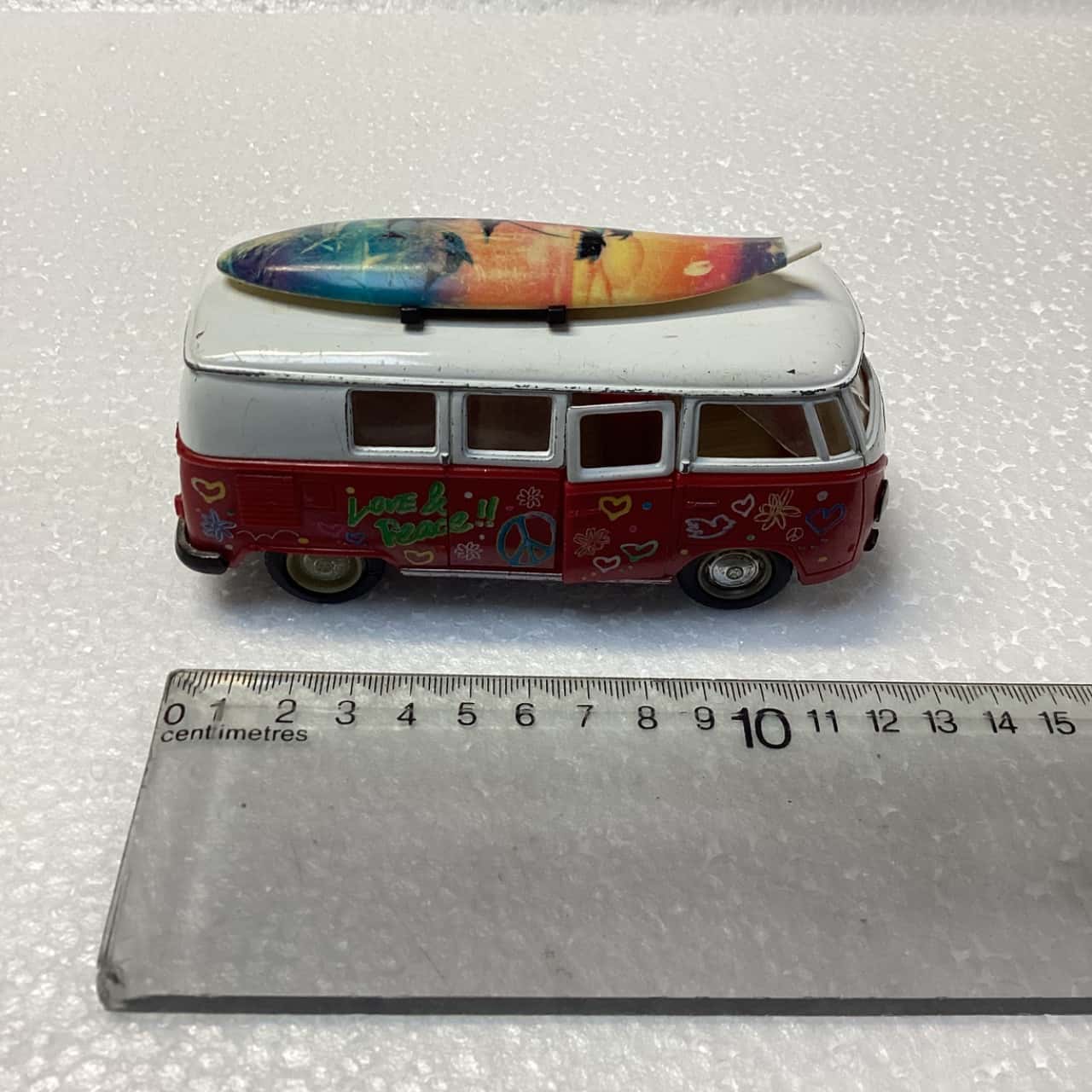 VW bus with surfboard. (s)