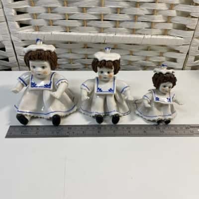 3 doll figurines 