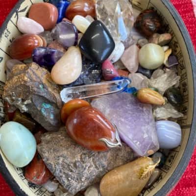 Vintage box filled with polished and raw stones
