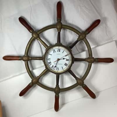 Vintage nautical wheel wall clock.