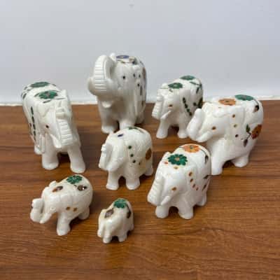 Collection of 8 marble inlay elephants 