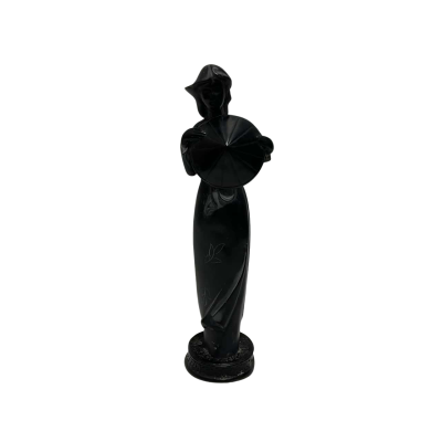 Sculpture Of A Women In A Traditional Dress 