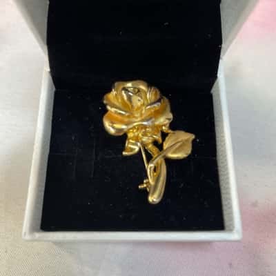 Rose Brooch in Gold Tones.