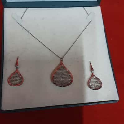 Italian 925 silver Teardrop pendant set featuring a diamond cut wire overlay on both the necklace and matching earrings on a fine chain silver