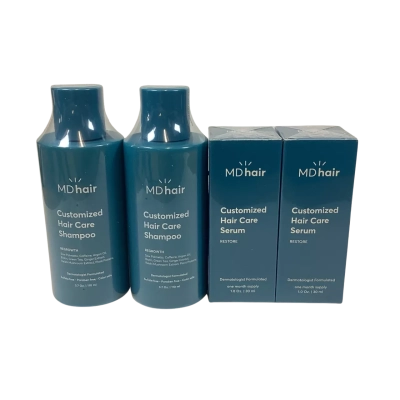 MDhair customized hair care shampoo and serum bottles.