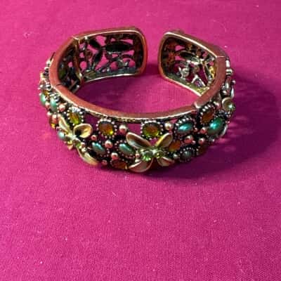  Women's Gold Tone Cuff Bracelet with Green Translucent Jewels and Flower Details