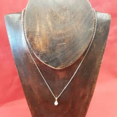 Gold Tone necklace featuring a solid Diamante pendant