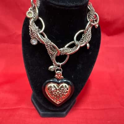  Women's Silver Tone Charm Bracelet featuring a Large Black Heart Pendant with Filigree Detailing 