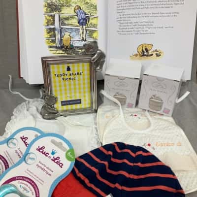 Get ready for baby with this beautiful collection of Winnie the Pooh book, teddy bear’s picnic photo frame, precious curl and tooth box, bibs, dummies, hat