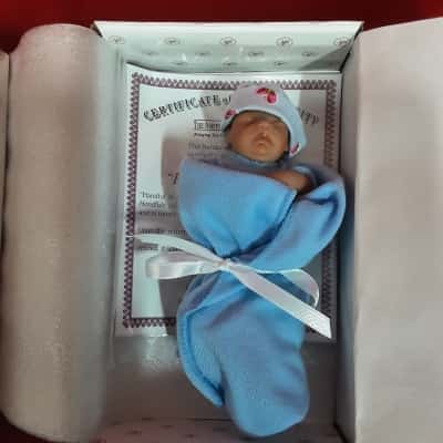 The Ashton Drake galleries handful of peace baby miniature doll